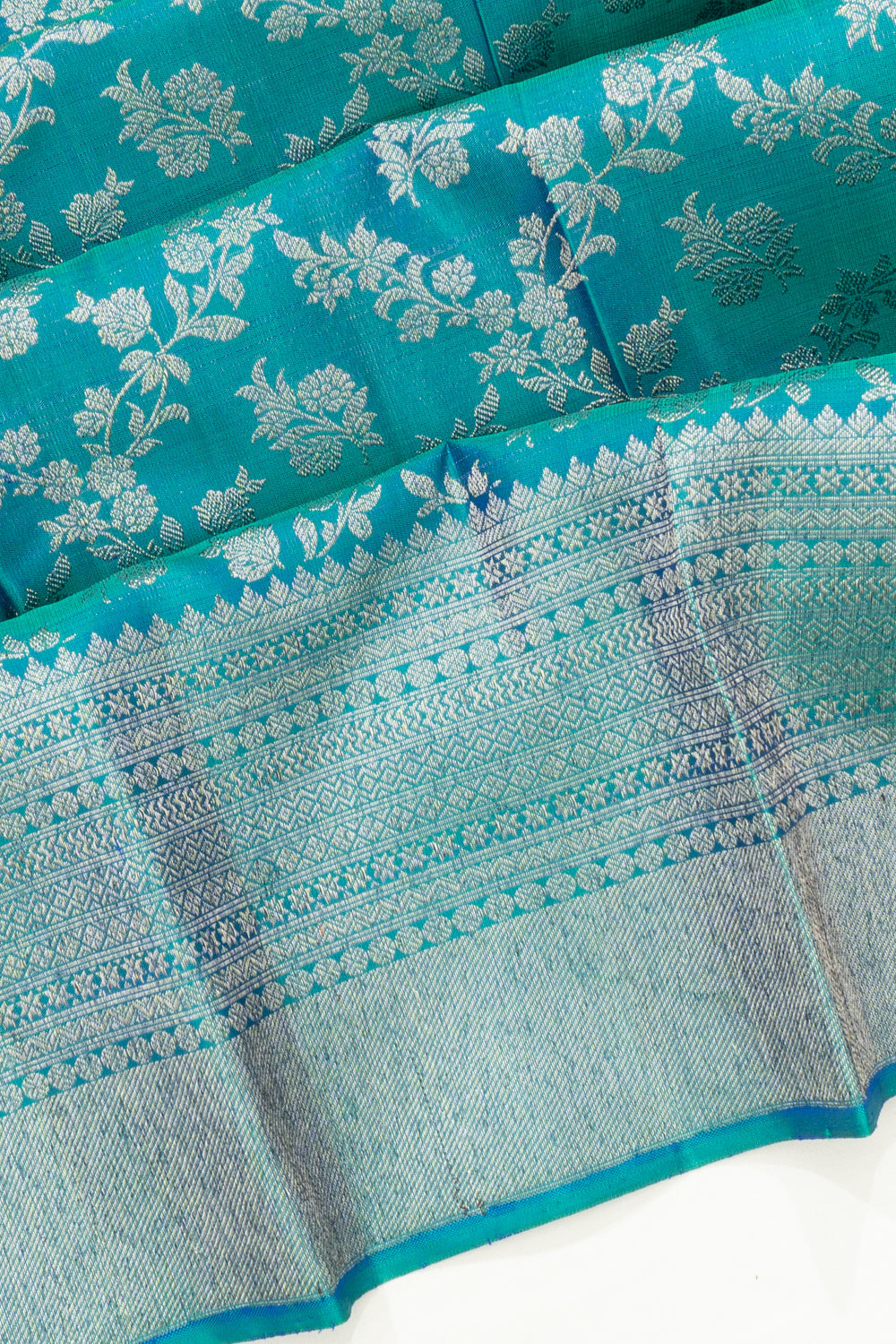 Kanchipuram Silk Antique Zari Jaal And Butta Teal Blue Saree